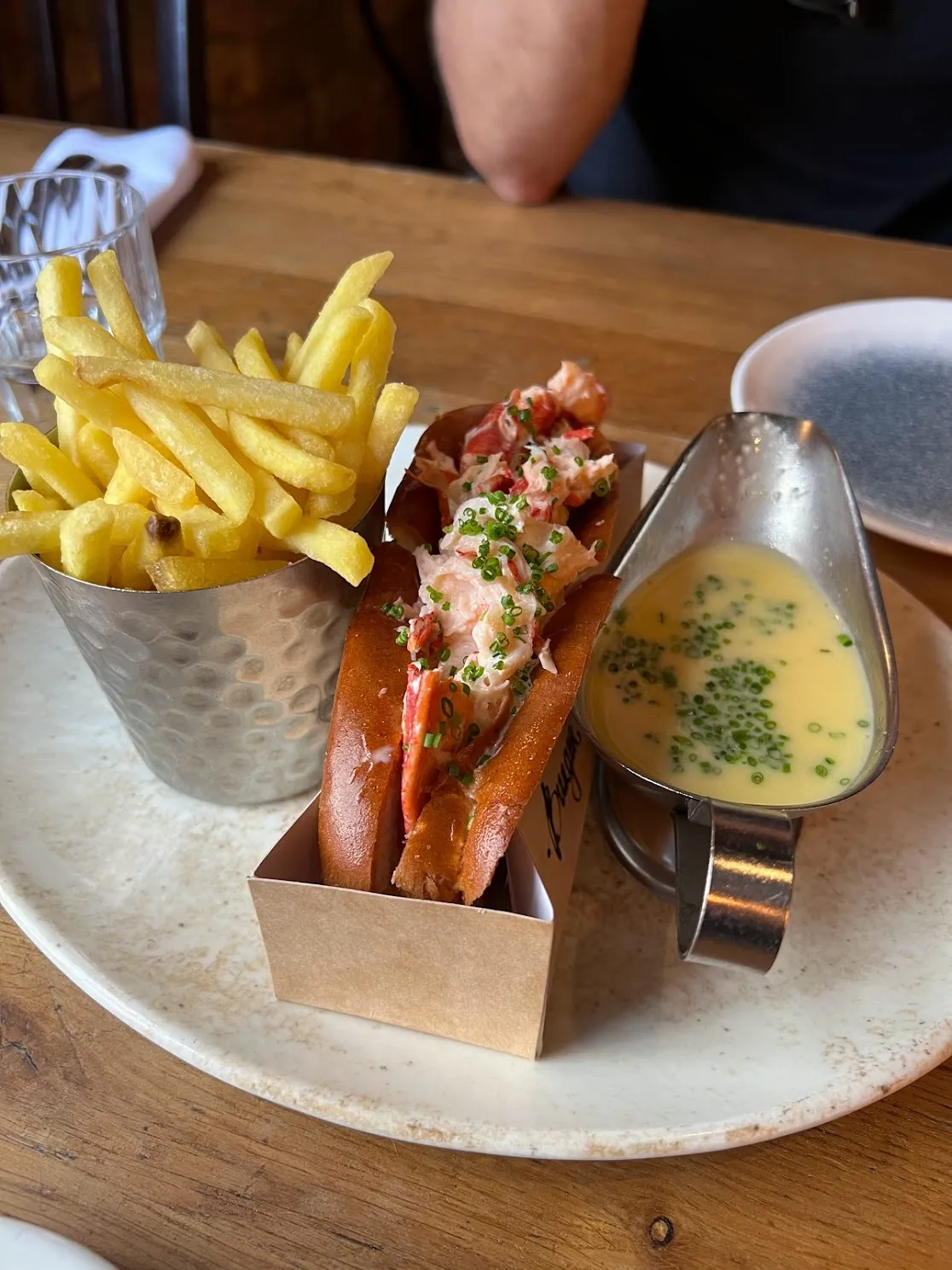 Lobster roll with fries and butter sauce