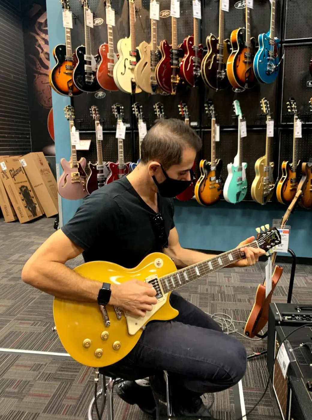 Mahdi Farra playing electric guitar