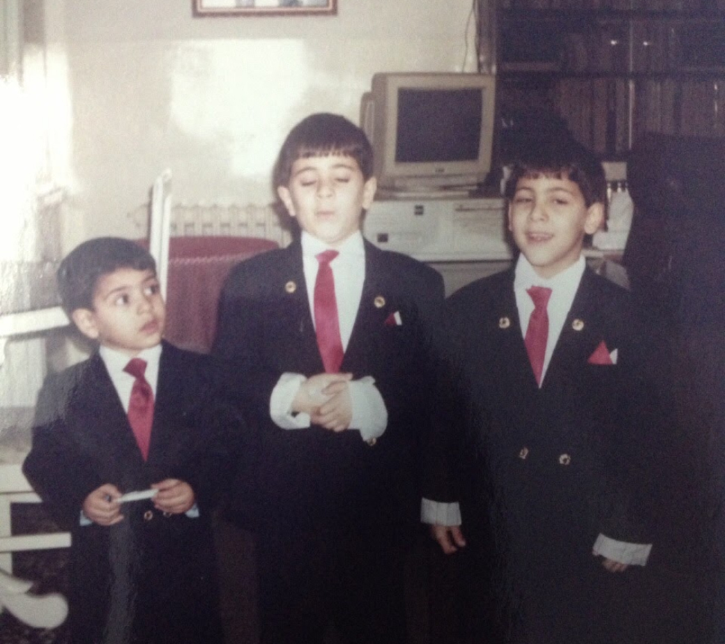 With my brothers and our first beloved computer in the
              background.