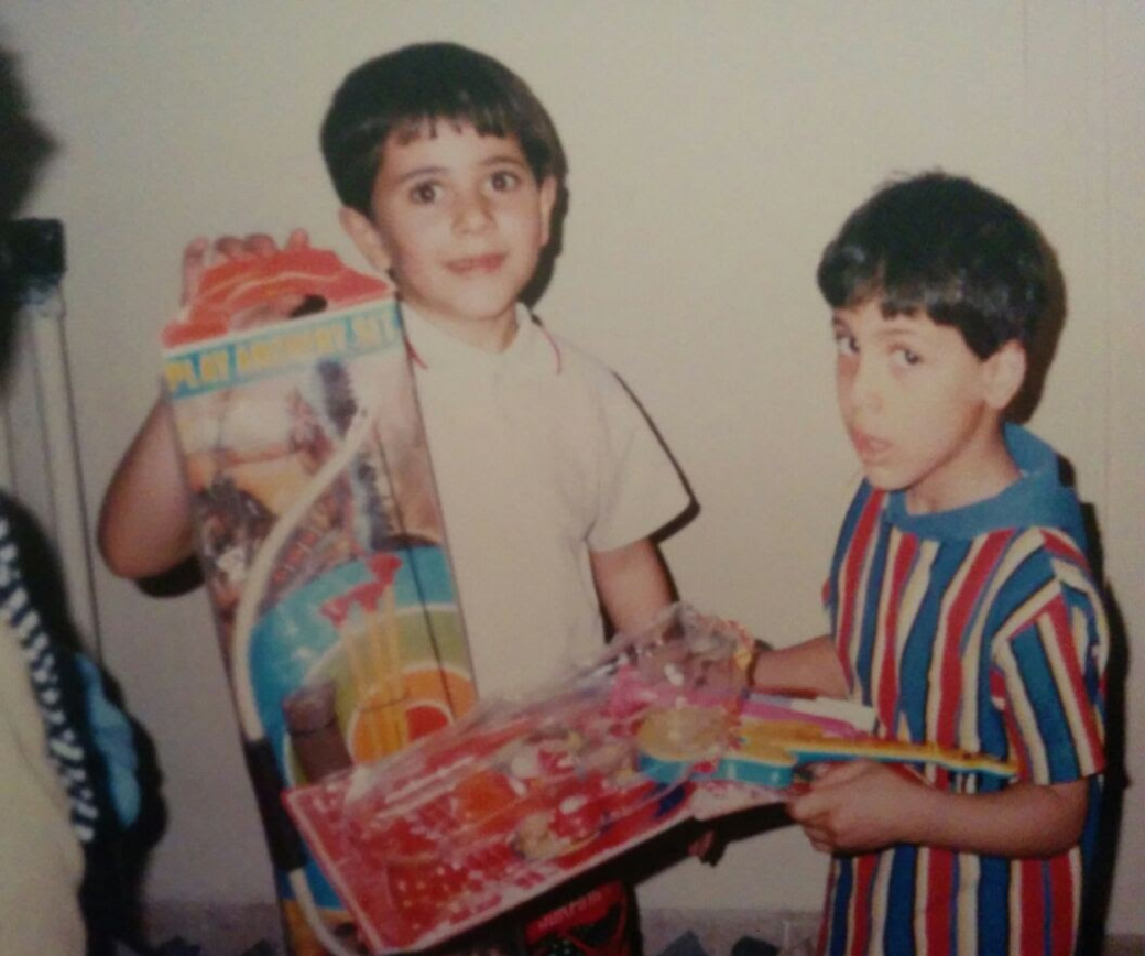 My brother and I holding to our dear toys.